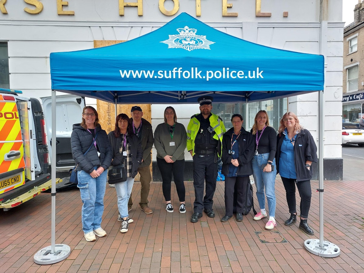 Police are joined by representatives from multiple agencies at a stand on Tavern Street, Ipswich